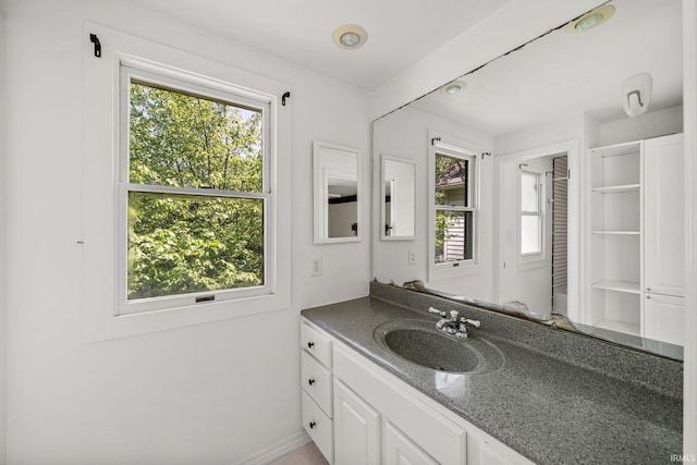 1602 Cedar St, South Bend, IN 46617 - bathroom featuring vanity and baseboards