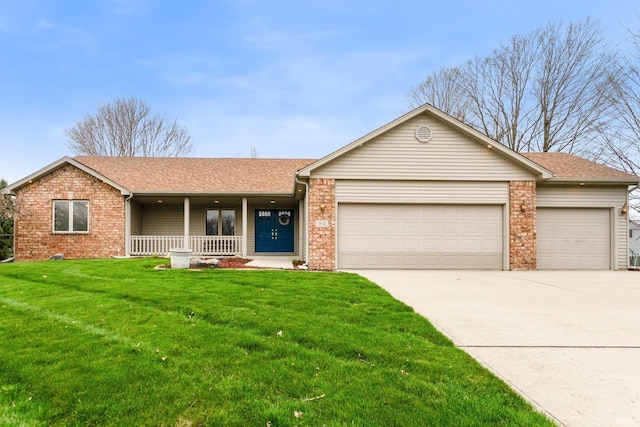 ranch-style house with an attached garage, covered porch, and brick siding