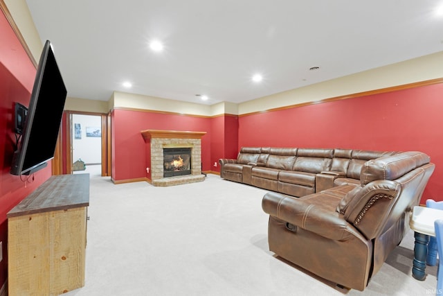carpeted living room with recessed lighting, a fireplace, and baseboards
