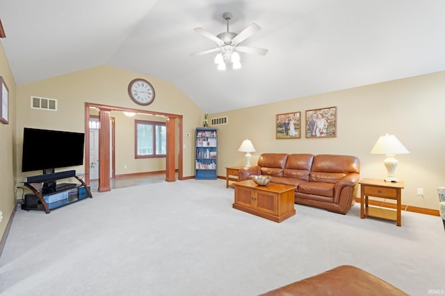 living area featuring light carpet, ceiling fan, lofted ceiling, baseboards, and ornate columns
