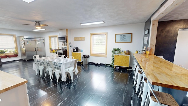 1804 W 11th St, Marion, IN 46953 - dining area featuring baseboards and ceiling fan