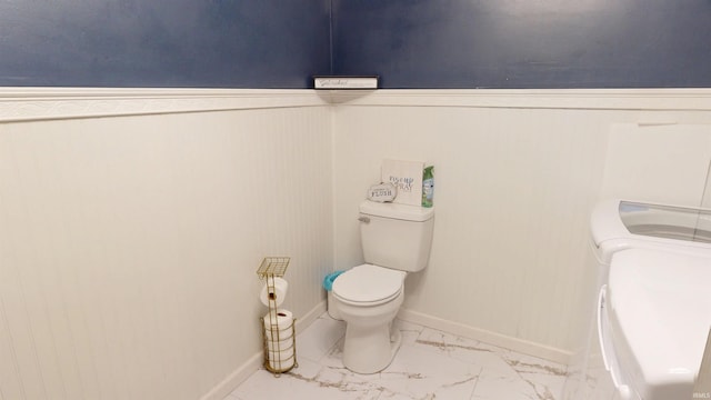 1804 W 11th St, Marion, IN 46953 - bathroom featuring toilet, marble finish floors, and baseboards