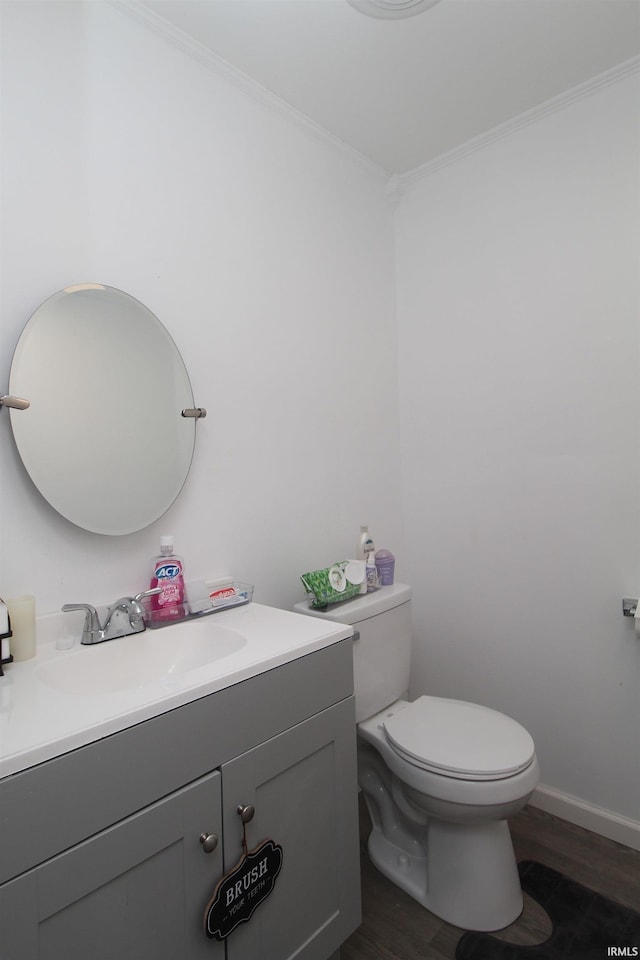 1804 W 11th St, Marion, IN 46953 - bathroom with wood finished floors, crown molding, vanity, and toilet