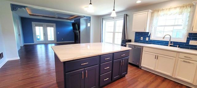 kitchen featuring a sink, dishwasher, dark wood-style flooring, white cabinets, and ceiling fan