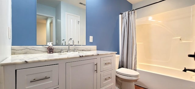 full bathroom featuring toilet, vanity, and shower / bath combo with shower curtain