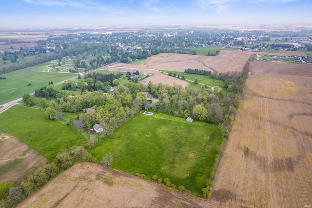aerial view of property's location featuring rural landscape and a tree filled landscape