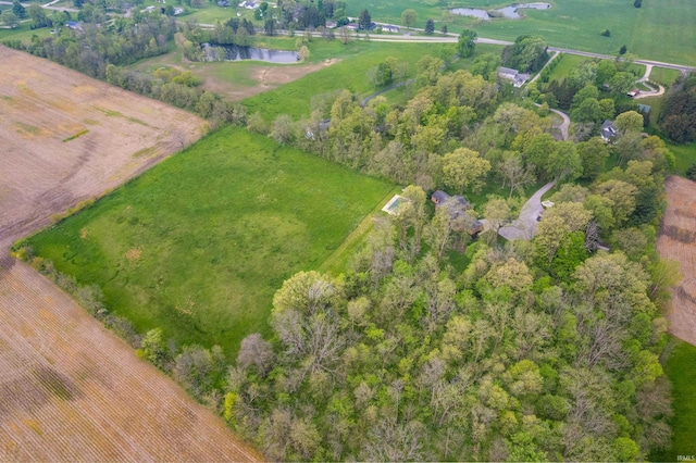 view of property location featuring a nearby body of water and rural landscape