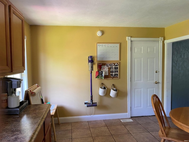 2800 E Bernice Dr, Bloomington, IN 47401 - dining space with light tile patterned flooring and baseboards