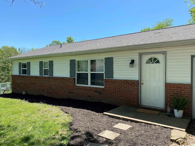 2800 E Bernice Dr, Bloomington, IN 47401 - doorway to property with brick siding, roof with shingles, and a yard