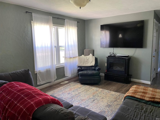 2800 E Bernice Dr, Bloomington, IN 47401 - living area featuring wood finished floors, baseboards, and a textured wall