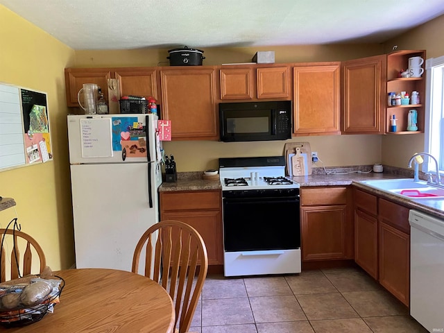 2800 E Bernice Dr, Bloomington, IN 47401 - kitchen with white appliances, a sink, light tile patterned floors, and open shelves