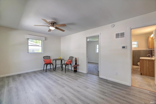 4184 Walker Ln, Unionville, IN 47468 - sitting room with a ceiling fan, wood finished floors, and baseboards