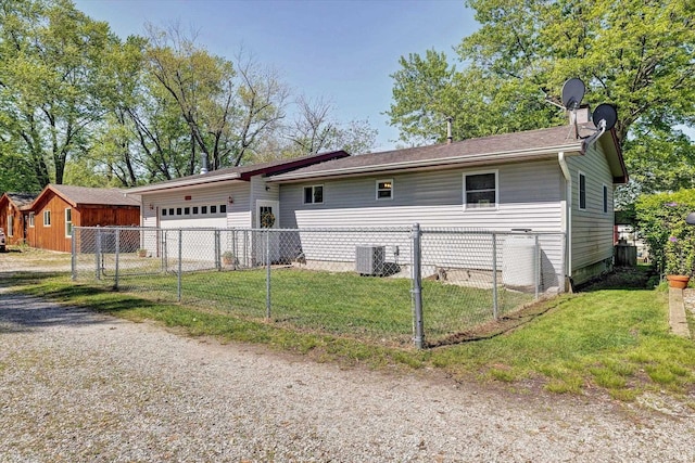 4184 Walker Ln, Unionville, IN 47468 - view of front facade with cooling unit, an attached garage, and driveway