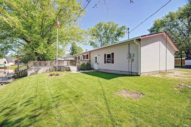 4184 Walker Ln, Unionville, IN 47468 - rear view of house with a wooden deck and a lawn