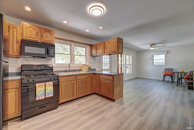 4184 Walker Ln, Unionville, IN 47468 - kitchen featuring black appliances, light wood-style floors, a peninsula, baseboards, and recessed lighting