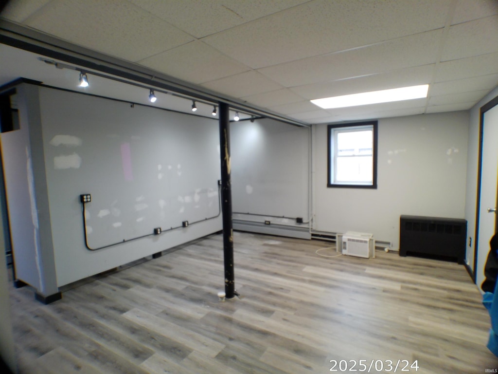 107 Basket Factory Rd, St, Butler, IN 46721 - basement featuring radiator, wood finished floors, and baseboard heating