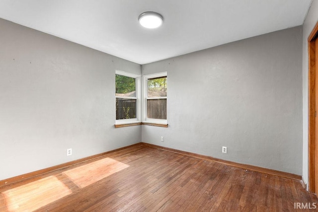 221 S Ironwood Dr, South Bend, IN 46615 - spare room with hardwood / wood-style floors and baseboards