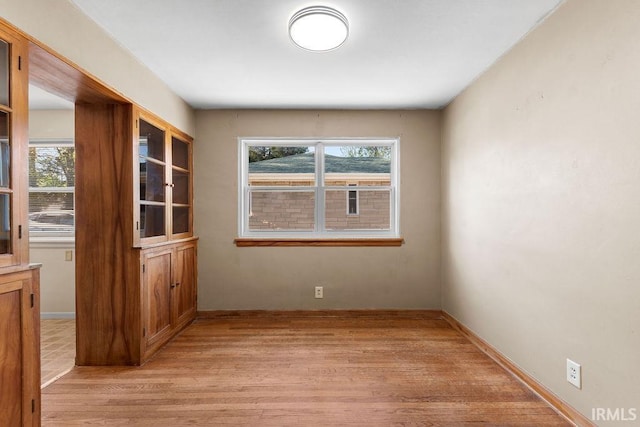 221 S Ironwood Dr, South Bend, IN 46615 - empty room featuring healthy amount of natural light, light wood-style floors, and baseboards