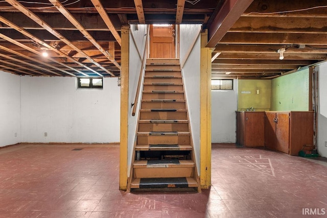 221 S Ironwood Dr, South Bend, IN 46615 - basement featuring stairs and tile patterned floors