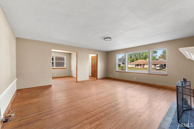 221 S Ironwood Dr, South Bend, IN 46615 - unfurnished living room with light wood finished floors and baseboards