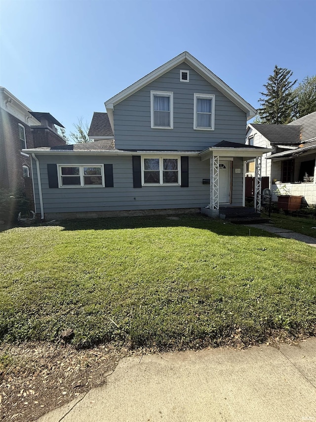 255 W Main St, Peru, IN 46970 - traditional home with a front yard and roof with shingles