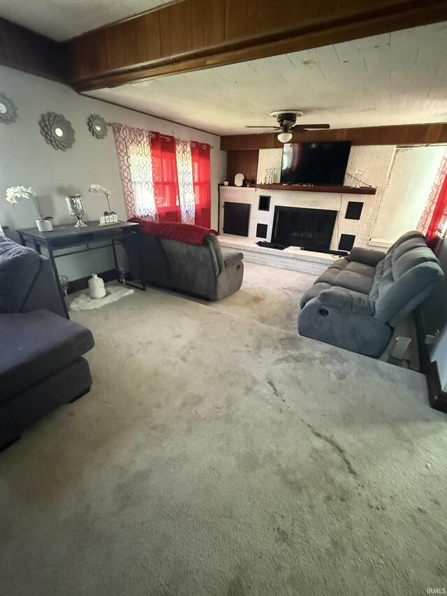 255 W Main St, Peru, IN 46970 - carpeted living area with a brick fireplace and a ceiling fan