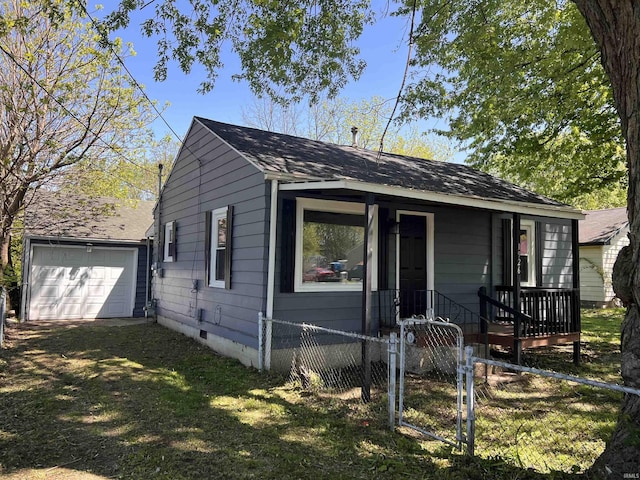 1926 E 17th St, Muncie, IN 47304 - bungalow-style house featuring a fenced front yard, crawl space, a gate, a shingled roof, and a garage