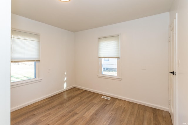 1926 E 17th St, Muncie, IN 47304 - spare room featuring light wood-style flooring, plenty of natural light, and baseboards