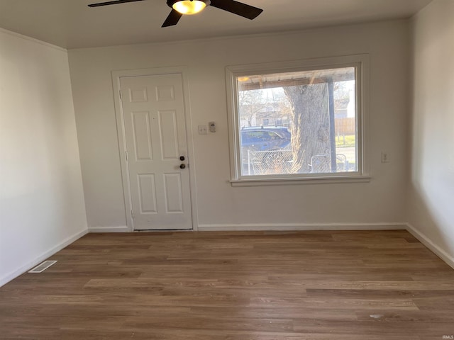 1926 E 17th St, Muncie, IN 47304 - entryway with ceiling fan, wood finished floors, and baseboards