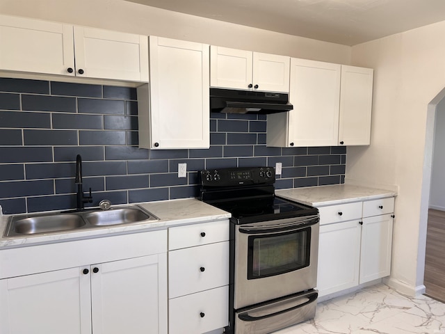 1926 E 17th St, Muncie, IN 47304 - kitchen featuring under cabinet range hood, electric stove, a sink, and white cabinets