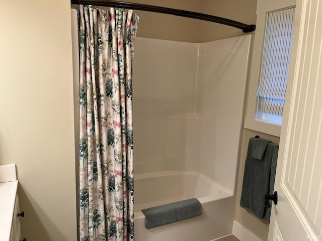 6425 E Wellston Dr, Bloomington, IN 47408 - bathroom featuring shower / bathtub combination with curtain