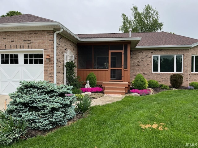 6425 E Wellston Dr, Bloomington, IN 47408 - single story home featuring brick siding, a front yard, a garage, and a shingled roof