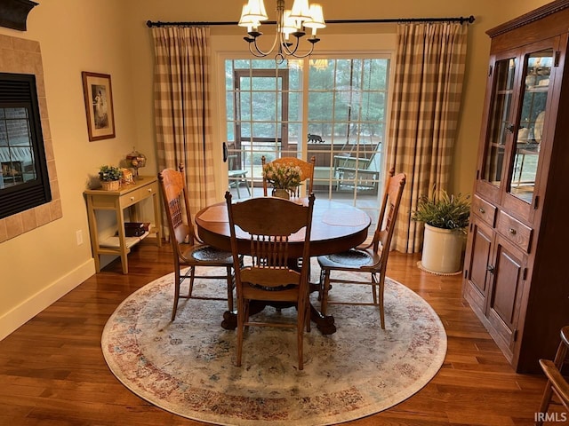6425 E Wellston Dr, Bloomington, IN 47408 - dining space featuring baseboards, a chandelier, and dark wood finished floors