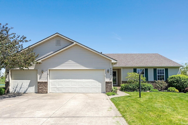 8928 Goshawk Ln, Fort Wayne, IN 46825 - view of front of home featuring driveway, brick siding, an attached garage, and a front yard