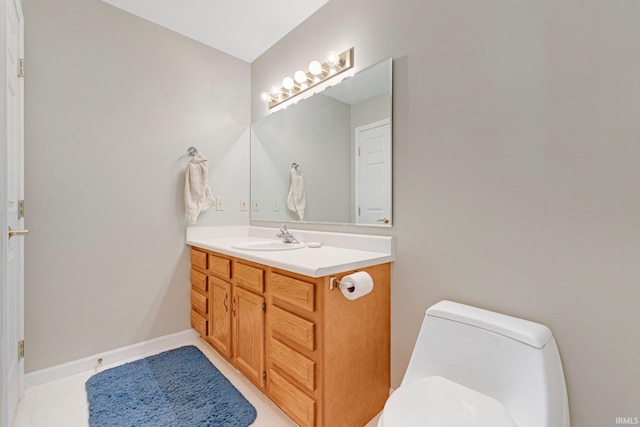 8928 Goshawk Ln, Fort Wayne, IN 46825 - bathroom featuring toilet, vanity, baseboards, and tile patterned floors