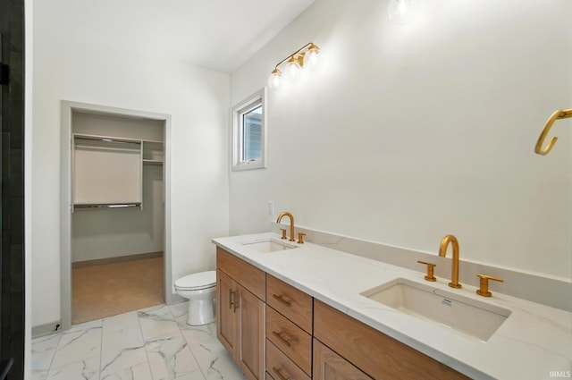 13222 Malfini Trl, Fort Wayne, IN 46845 - full bathroom with marble look tile flooring, a walk in closet, toilet, and double vanity