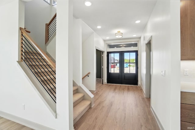 13222 Malfini Trl, Fort Wayne, IN 46845 - entrance foyer with stairs, light wood-style floors, french doors, baseboards, and recessed lighting
