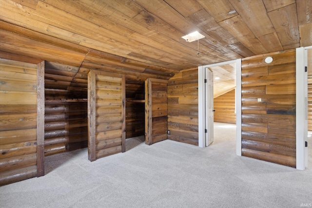 additional living space featuring wood ceiling, carpet, and rustic walls