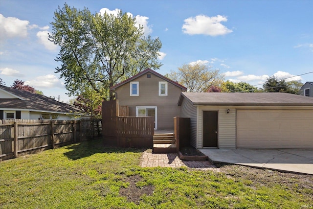 view of front of property with an attached garage, a deck, and concrete driveway