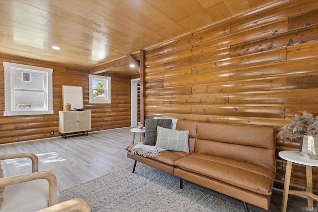 living room featuring log walls, wood finished floors, and wood ceiling