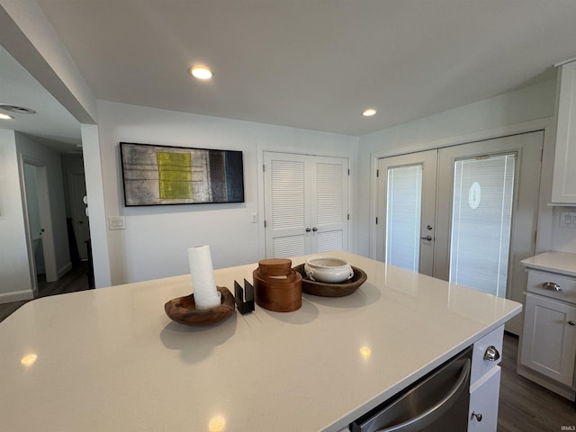 kitchen featuring french doors, light countertops, recessed lighting, and dark wood finished floors