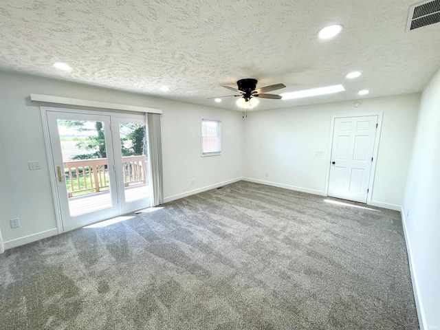 spare room with recessed lighting, baseboards, carpet, ceiling fan, and a textured ceiling
