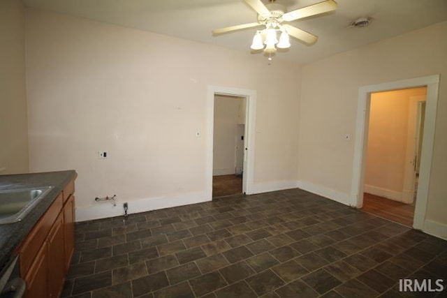 128 E Washington St, Williamsport, IN 47993 - empty room with a ceiling fan and a sink