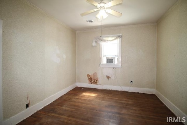 128 E Washington St, Williamsport, IN 47993 - empty room with wood finished floors, baseboards, ceiling fan, and cooling unit