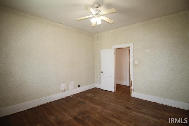128 E Washington St, Williamsport, IN 47993 - unfurnished room featuring wood finished floors, ceiling fan, baseboards, and crown molding