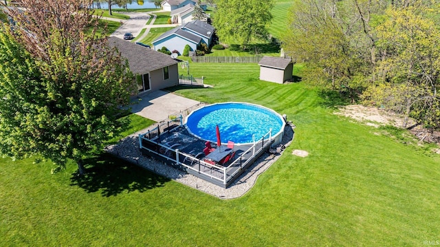 706 Taylor Ln, Albion, IN 46701 - view of swimming pool featuring a storage shed, an outdoor structure, and a patio area