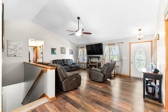 706 Taylor Ln, Albion, IN 46701 - living area with vaulted ceiling, wood finished floors, ceiling fan, baseboards, and a chandelier