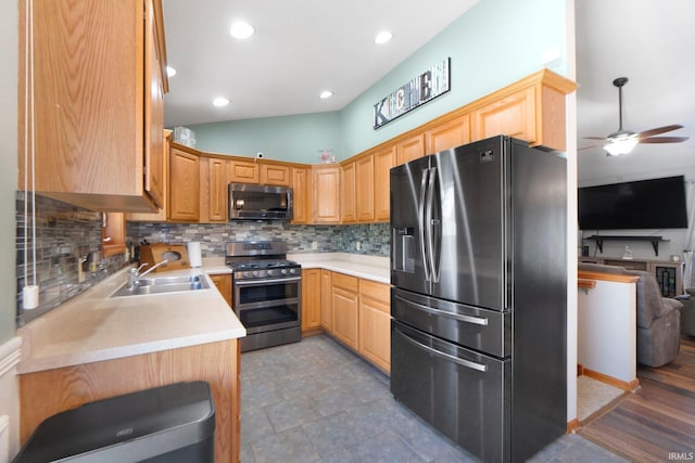 706 Taylor Ln, Albion, IN 46701 - kitchen with stainless steel appliances, a sink, a ceiling fan, tasteful backsplash, and light countertops
