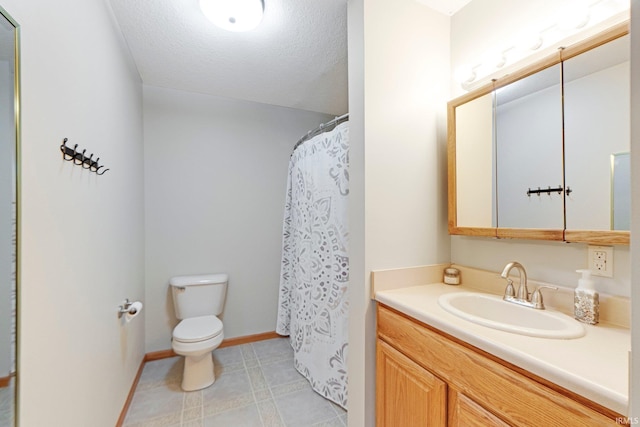 706 Taylor Ln, Albion, IN 46701 - full bath with toilet, baseboards, vanity, a textured ceiling, and tile patterned flooring