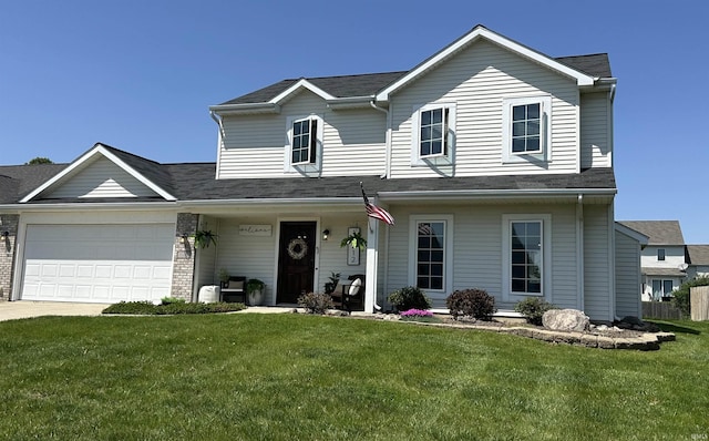 view of front of home featuring a front yard, a garage, concrete driveway, and covered porch